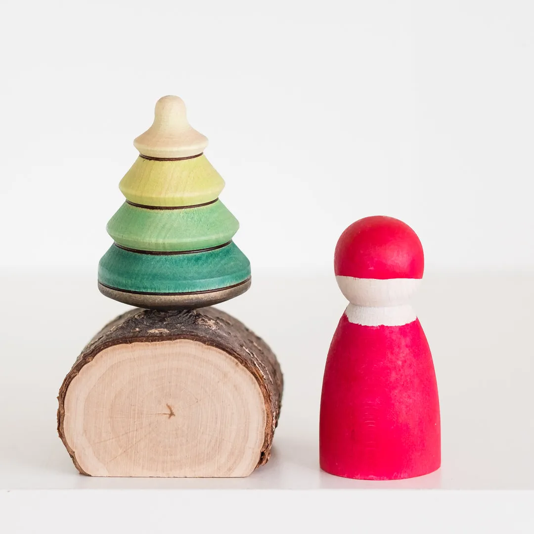 baumkreisel tree on log stand top